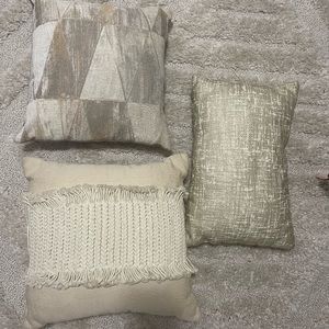 Gold and cream throw pillows